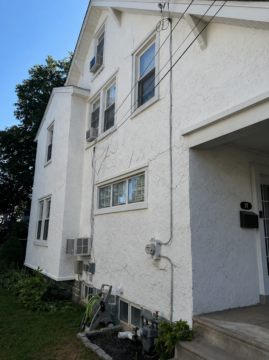 Damaged residential stucco before repair